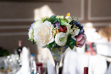 Wedding table with flower composition 
