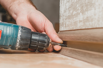 Technology of installation and installation of plastic floor plinth - fixing the baseboard to a wall made of plasterboard, wood or foam block