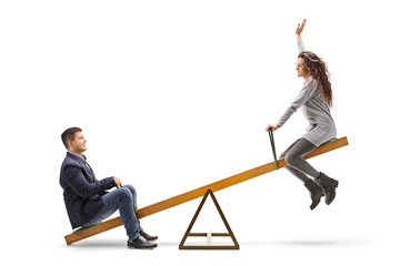 Young couple on a seesaw