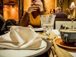 woman at the table and dishes in restaurant