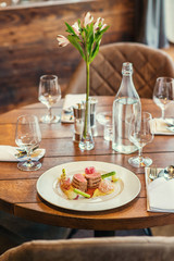 delicious pork fillet with potatoes mash and vegetables served on white plate with sauce, product photography  for restaurant
