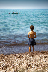 Boy admiring sea