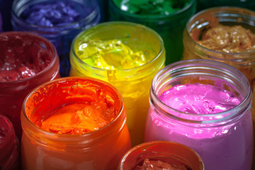 orange and pink colors of screen printing ink for print on tee shirts and fabric. .plastisol ink useful in tee shirt factory and textile for export.