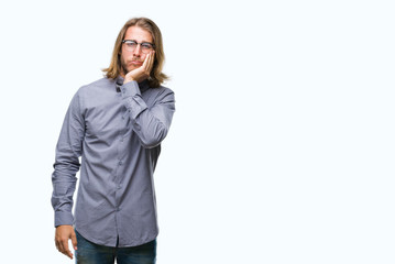 Young handsome man with long hair wearing bow tie over isolated background thinking looking tired...