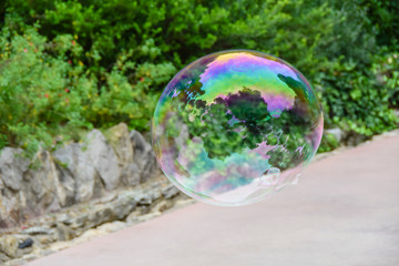huge lots of soap bubbles multicolored bright reflections water summer bokeh 