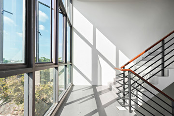 Window and Stair in Modern Apartment, sunlight and shadows in stairs way.