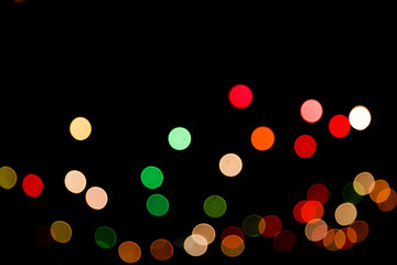 Colorful abstract bokeh lights Christmas background for your design.