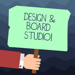 Text sign showing Design And Board Studio. Conceptual photo Modern designing space professional office Hu analysis Hand Holding Blank Colored Placard with Stick photo Text Space
