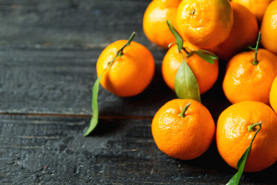 Bright juicy tangerines closeup with copy space