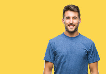 Obraz premium Young handsome man over isolated background with a happy and cool smile on face. Lucky person.