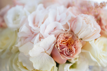 Wedding flowers, bridal bouquet closeup. Decoration made of roses, peonies and decorative plants, close-up, selective focus, nobody, objects
