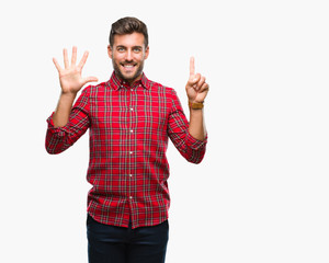 Naklejka premium Young handsome man over isolated background showing and pointing up with fingers number six while smiling confident and happy.