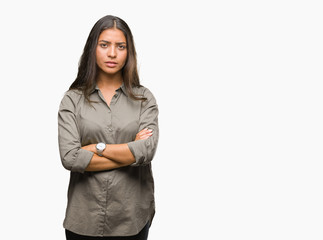 Young beautiful arab woman over isolated background skeptic and nervous, disapproving expression on face with crossed arms. Negative person.