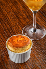 vanilla souffle with mango sorbet and vanilla ice cream with served on wooden table, product photography for restaurant