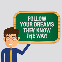 Handwriting text Follow Your Dreams They Know The Way. Concept meaning Inspiration motivation to get success Man Standing Holding Stick Pointing to Wall Mounted Blank Color Board