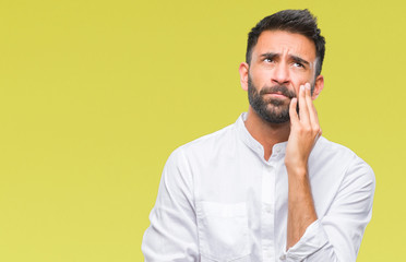 Adult hispanic man over isolated background thinking looking tired and bored with depression problems with crossed arms.