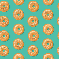 Seamless pattern with top view of fresh bagels, white and brown sesame seeds on top. Delicious breakfast. Vector seamless pattern. - 238759051