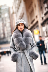 Gorgeous woman posing in luxurious fur coat