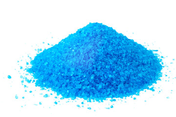 Small pile of blue bath salts on the white background