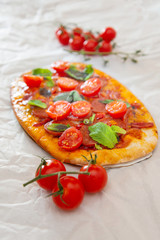 Sausage Pizza with Ham and tomatoes