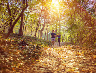 Fototapeta premium running - athlete runners training jogging. Exercising runner couple working out living healthy lifestyle training.