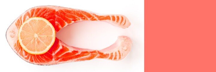 Fresh Sea Salmon Fish Steak trend toned Living coral color with slice of yellow lemon isolated on white background with background trend color Living Coral. Top view. Flat lay. Header for fish site.