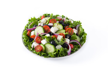 Fresh Greek salad in Plate with black olive,tomato,feta cheese, cucumber and onion isolated on white background
