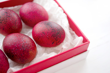 Red Easter eggs in a gift red box, the top view.