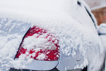 car headlight in the snow in winter