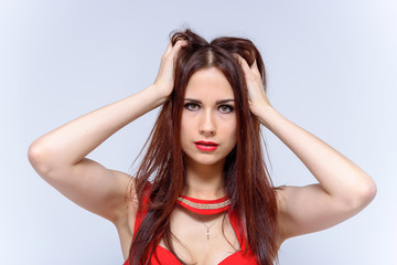 Studio portrait of a young pretty woman on a white background