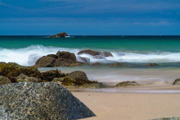 Fototapeta na wymiar long exposure beach rocks sea