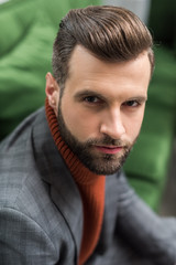 portrait of serious man in formal wear looking at camera