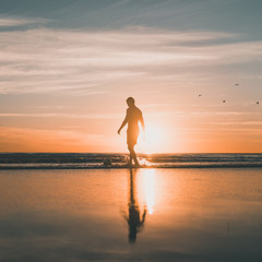 Playing football at Cable Beach