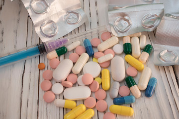 Drug addiction and chemsex illustration with syringe and pills