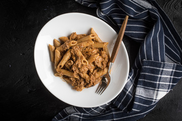 Penne pasta with pork sauce.