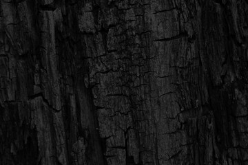 black uneven background with carbon texture