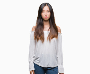 Young asian woman over isolated background depressed and worry for distress, crying angry and afraid. Sad expression.