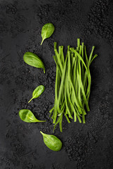 Raw homemade spinach pasta with spinach leaves