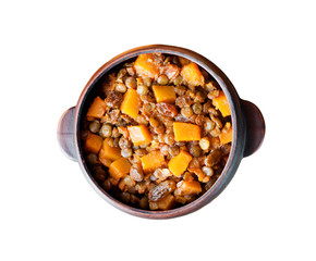 Spicy curry with green lentils, pumpkin and raisins isolated with clipping path