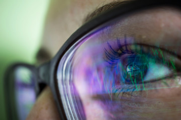 businesswoman in glasses, the reflection in the glasses graphs, tables, sale
