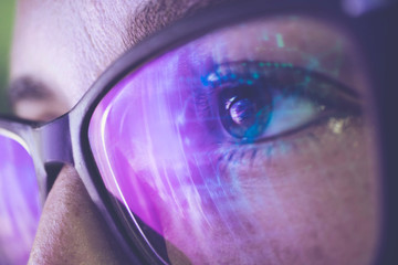 businesswoman in glasses, the reflection in the glasses graphs, tables, sale