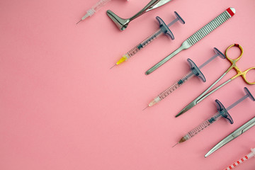 Flat lay of medical instruments on rose background. Mock up health care medical background.