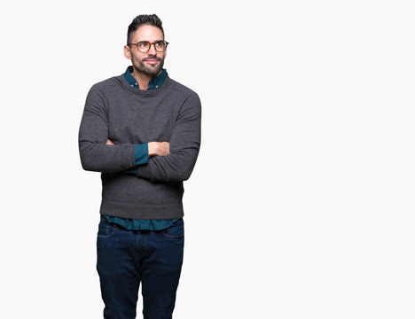 Young handsome man wearing glasses over isolated background smiling looking side and staring away thinking.