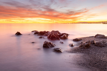 Fototapeta na wymiar Silk effect in the water of a beach at sunset