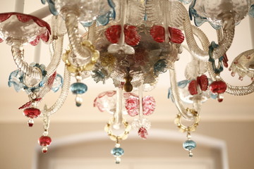 Chandelier made of glass with some colorful applications