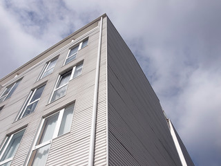 Building facade with metallic cladding. Construction elements of modern architecture 