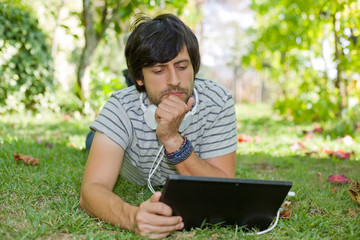 man relaxing with tablet pc