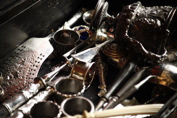 Detail closeup of silverware in a chest