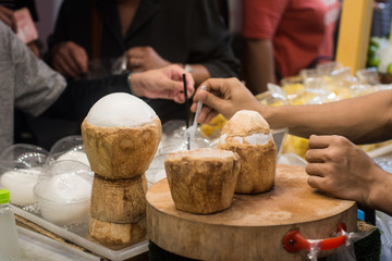 Thai street food : Young Coconut on sale in the market