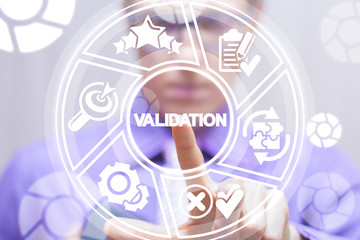 Validation business concept. Man pushing a validation word button on a virtual round interface.